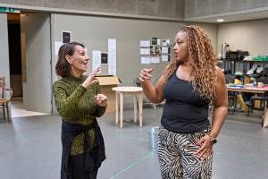 Arlene Phillips and Marisha Wallace stand in a dance studio in conversation.