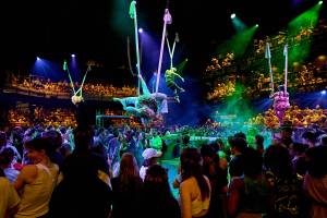 The Fairies fly in aerial silks above the audience