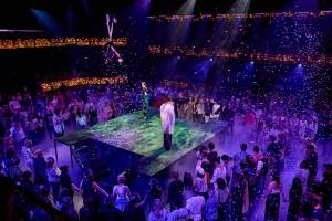 The audience hold hands and circle Titania and Oberon
